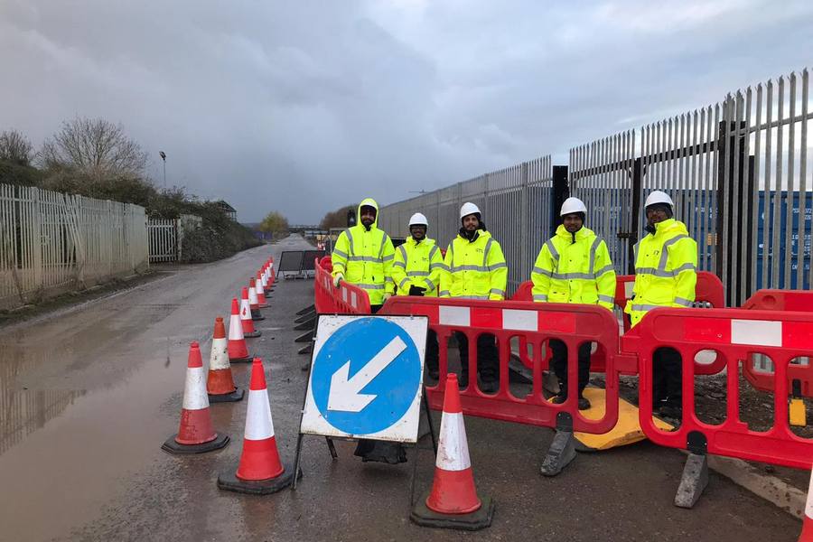 Streetworks gang setting out signing, lighting and guarding in Hampshire